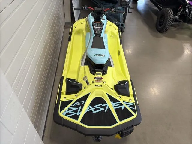 Slide: The Image of 2025 Yamaha Waverunner Jetblaster in showroom, vibrant yellow and blue design. - 8