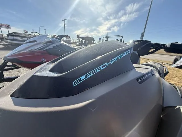 Slide: The Image of 2025 Yamaha WaveRunner GP SVHO™ jet ski, supercharged, parked outdoors under a clear sky. - 10