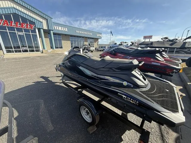 Slide: The Image of 2025 Yamaha WaveRunner GP SVHO™ jet ski displayed at dealership, parked on trailer. - 4