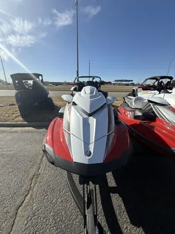 Slide: The Image of 2025 Yamaha Waverunner GP HO with Audio, red and white, parked outdoors on a sunny day. - 7