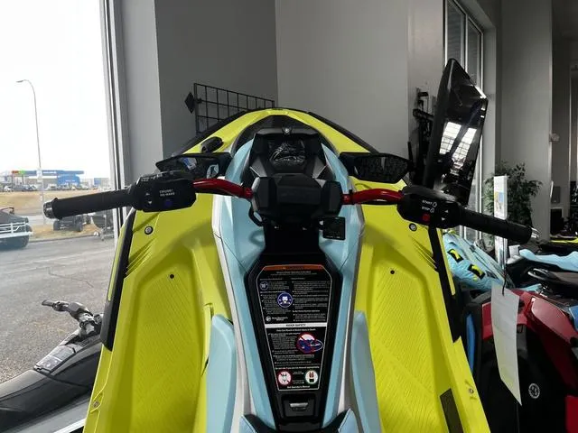 Slide: The Image of 2025 Yamaha Waverunner Jetblaster in showroom, vibrant yellow and blue design, handlebars visible. - 6