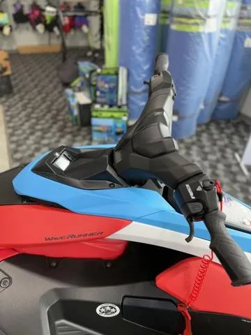 Slide: The Image of 2025 Yamaha Waverunner Jetblaster DLX 2-Up, vibrant red and blue design, showroom display. - 10