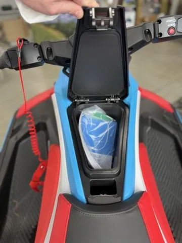 Slide: The Image of 2025 Yamaha Waverunner Jetblaster DLX 2-Up storage compartment with safety gear inside. - 12