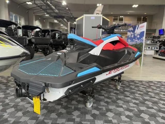 Slide: The Image of 2025 Yamaha Waverunner Jetblaster DLX 2-Up in showroom, featuring vibrant red and blue design. - 6