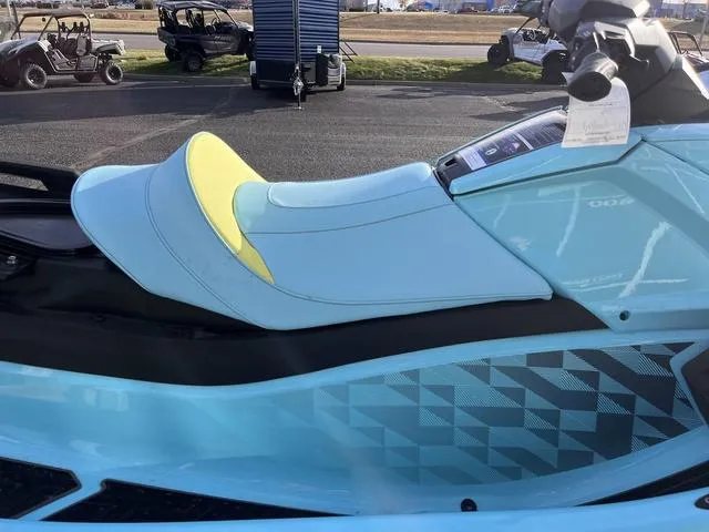Slide: The Image of 2025 Yamaha Waverunner VX Limited HO with blue and yellow seat, parked outdoors. - 21
