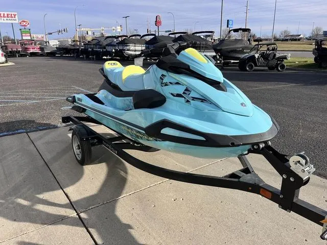 Slide: The Image of 2025 Yamaha Waverunner VX Limited HO in light blue on a trailer, parked outdoors. - 6