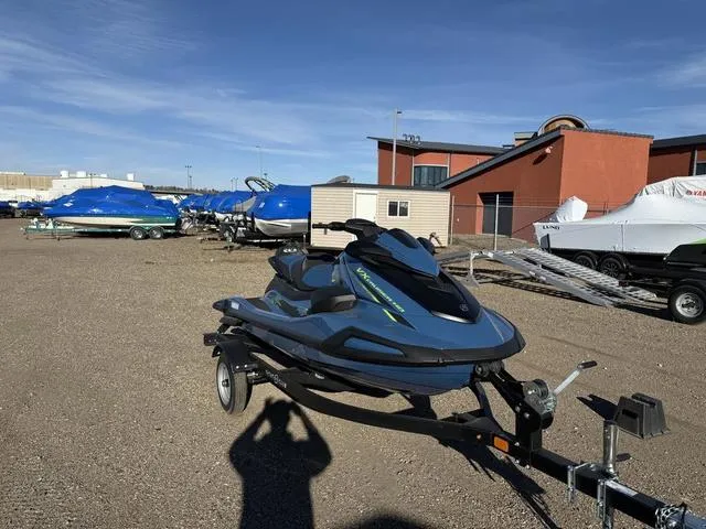 Slide: The Image of 2025 Yamaha WaveRunner VX Cruiser® HO with Audio on trailer, parked outdoors. - 2