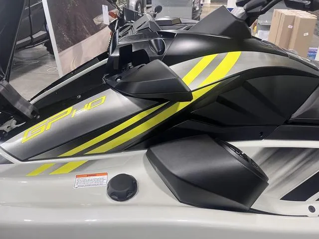 Slide: The Image of 2025 Yamaha Waverunner GP HO with Audio, sleek design, yellow accents, side view. - 6