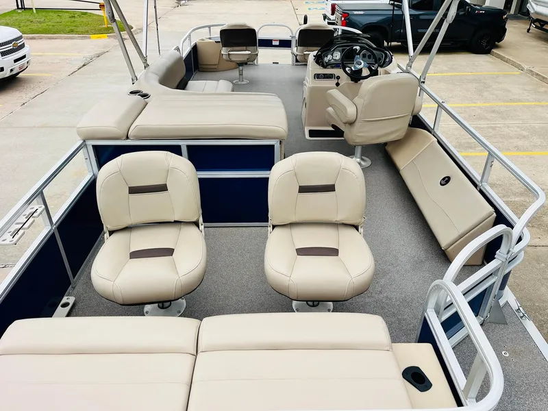 Slide: The Image of 2017 Sun Tracker Fishin' Barge 22 XP3 pontoon boat with beige seating and spacious deck layout. - 11