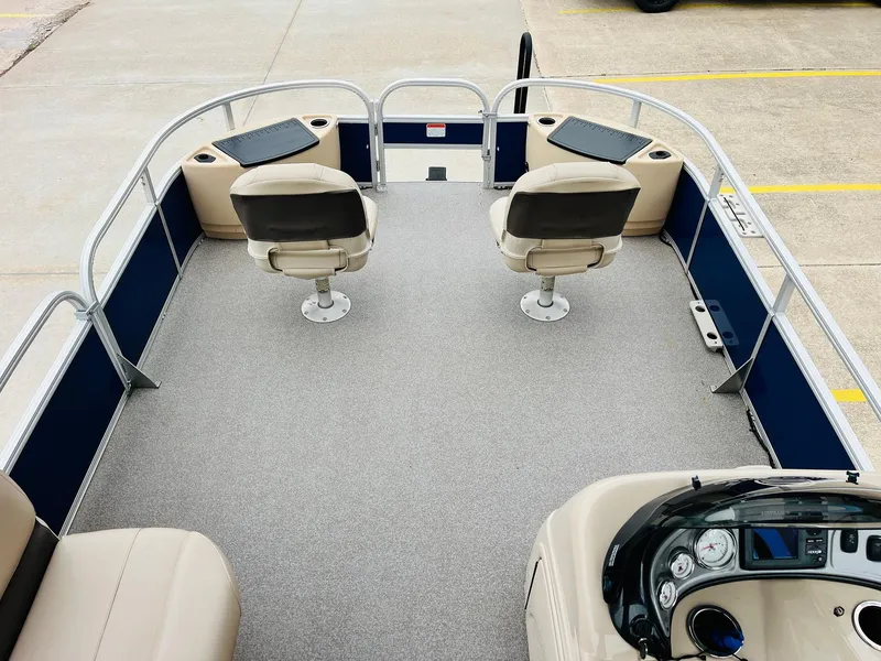 Slide: The Image of 2017 Sun Tracker Fishin' Barge 22 XP3 interior with seating and control panel. - 12