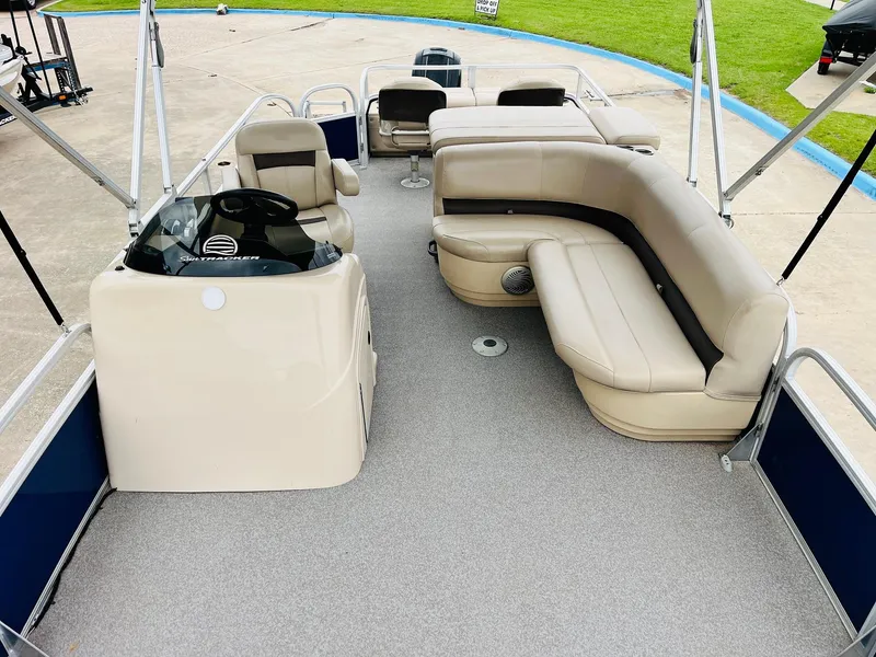 Slide: The Image of 2017 Sun Tracker Fishin' Barge 22 XP3 pontoon boat with spacious seating and helm. - 19