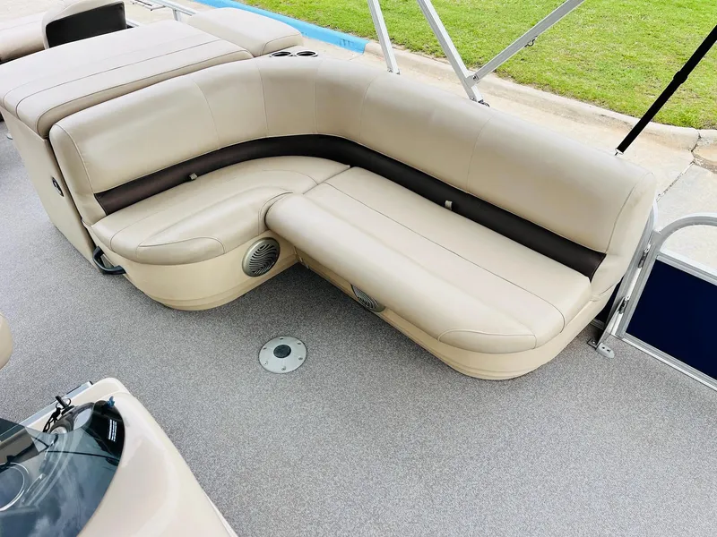 Slide: The Image of 2017 Sun Tracker Fishin' Barge 22 XP3 interior with beige seating and gray flooring. - 20