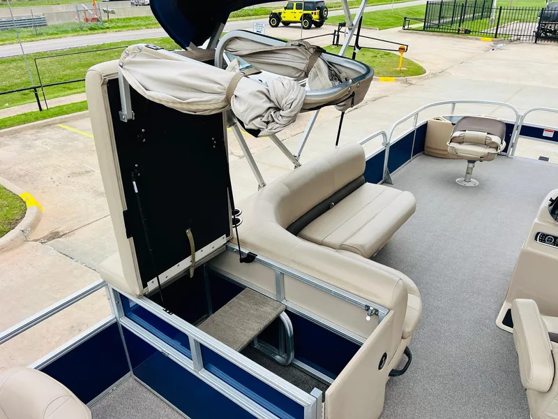 Slide: The Image of 2017 Sun Tracker Fishin' Barge 22 XP3 interior with seating and storage compartments. - 34