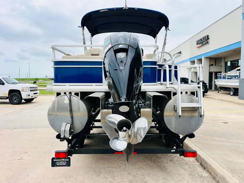 Slide: The Image of 2017 Sun Tracker Fishin' Barge 22 XP3 pontoon boat, rear view with motor and propeller. - 7