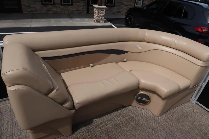 Slide: The Image of Beige seating on 2016 Bennington 22 SLX pontoon boat, outdoor setting. - 10
