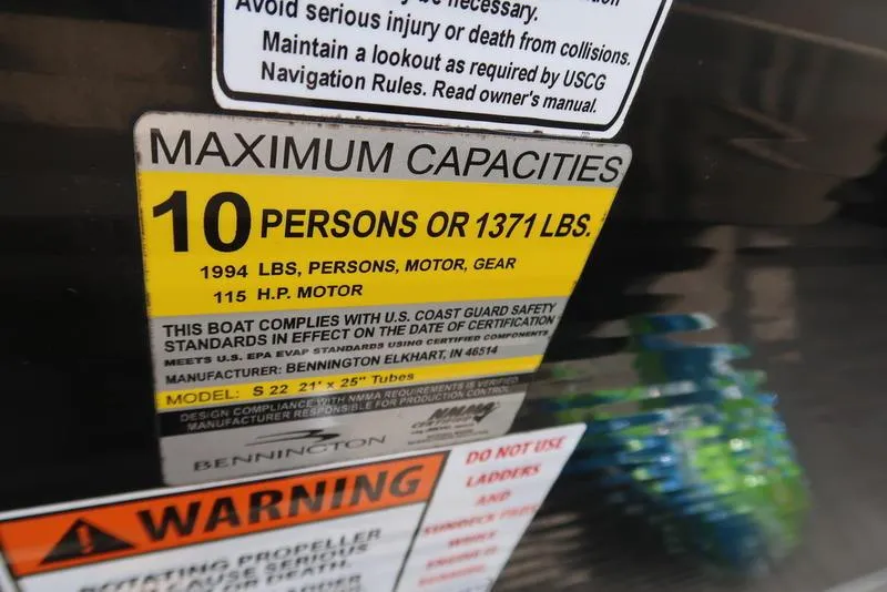 Slide: The Image of 2016 Bennington 22 SLX capacity label, maximum 10 persons or 1371 lbs, 115 HP motor. - 12