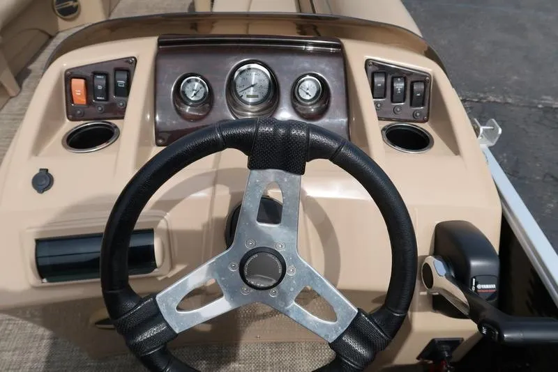 Slide: The Image of Steering console of a 2016 Bennington 22 SLX boat with gauges and controls. - 14