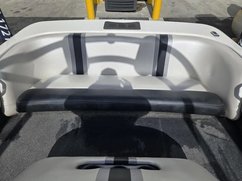 Slide: The Image of 2001 Malibu Sportster boat interior with gray and white seating. - 15