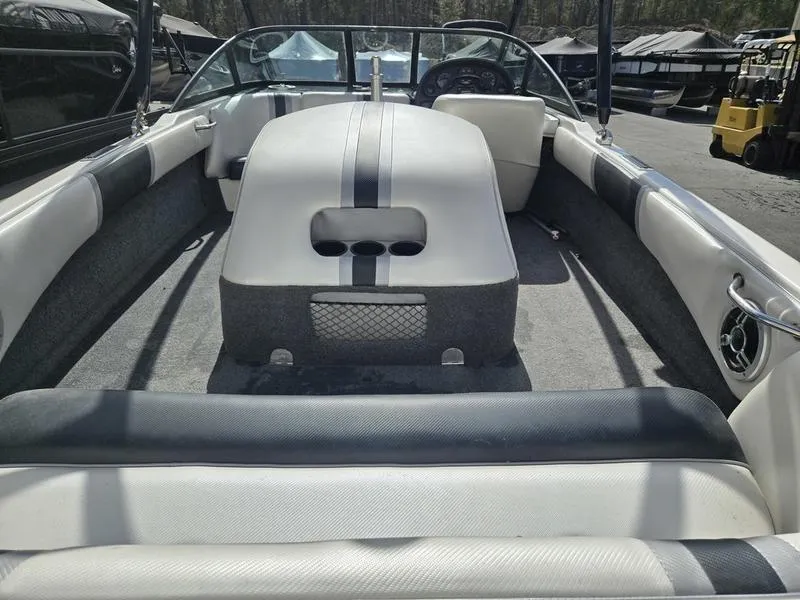 Slide: The Image of 2001 Malibu Sportster boat interior with seating and dashboard view. - 18