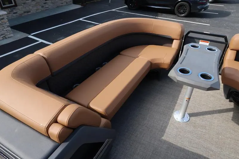 Slide: The Image of 2025 Bennington M Quad Bench 24 MFB with tan seating and cup holders. - 11