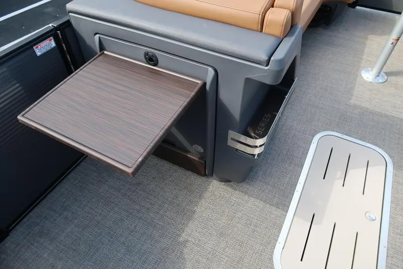 Slide: The Image of Bennington M Quad Bench 24 MFB 2025 with pull-out table on boat deck. - 12