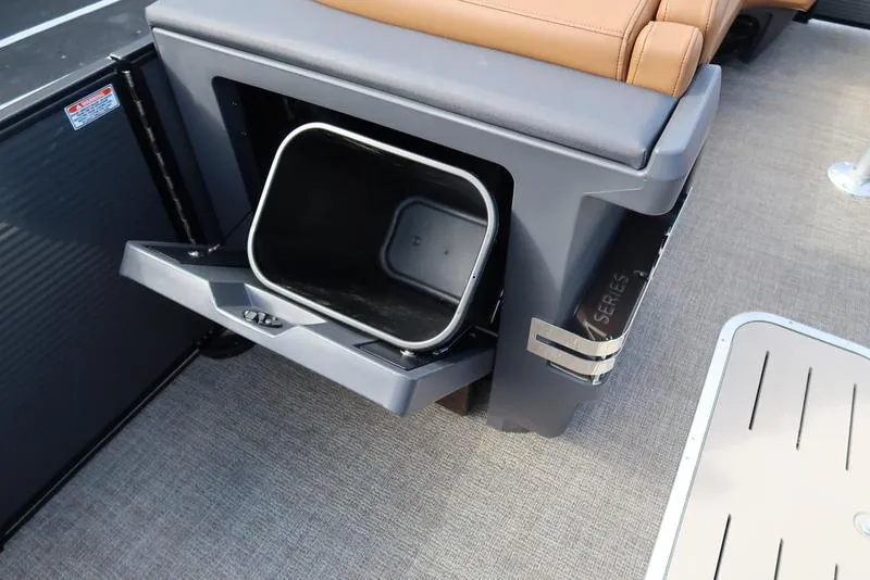 Slide: The Image of 2025 Bennington M Quad Bench 24 MFB with integrated storage compartment. - 15