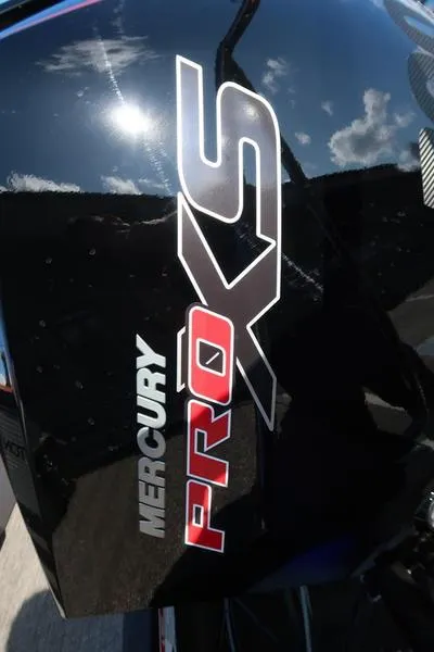 Slide: The Image of Mercury Pro XS engine on Bennington M Quad Bench 24 MFB, 2025 model, reflecting sunlight. - 21