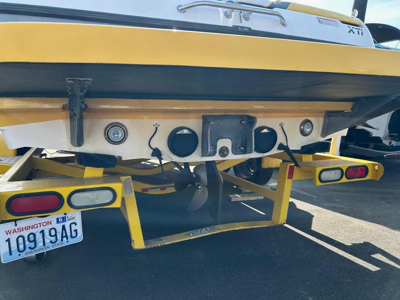 Slide: The Image of 2002 Malibu Wakesetter 21 XTi boat rear view with trailer and Washington license plate. - 2