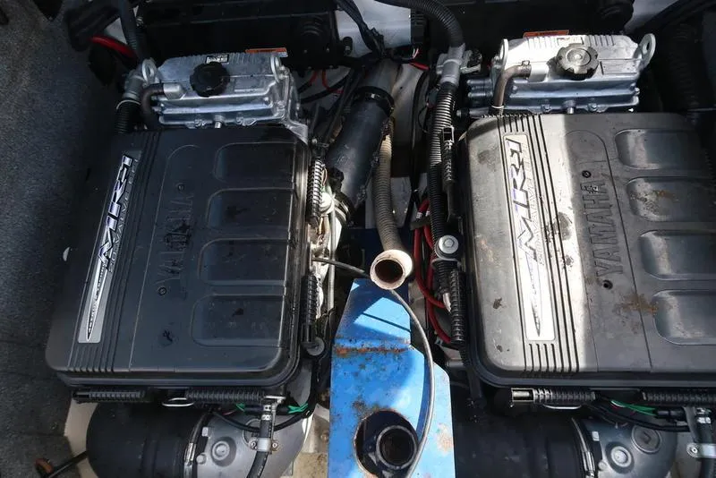 Slide: The Image of Twin engines of a 2004 Yamaha Boats SX 230, showcasing detailed mechanical components. - 13