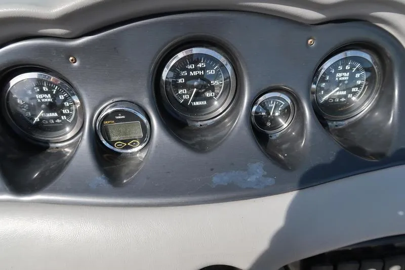 Slide: The Image of Dashboard of a 2004 Yamaha Boats SX 230, featuring speedometer and RPM gauges. - 14