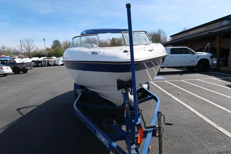 Slide: The Image of 2004 Yamaha Boats SX 230 on trailer in parking lot. - 4