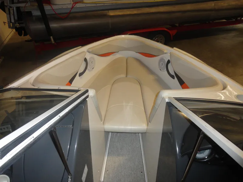 Slide: The Image of 2005 Campion Chase 550I BR boat interior with white seating and open bow design. - 13