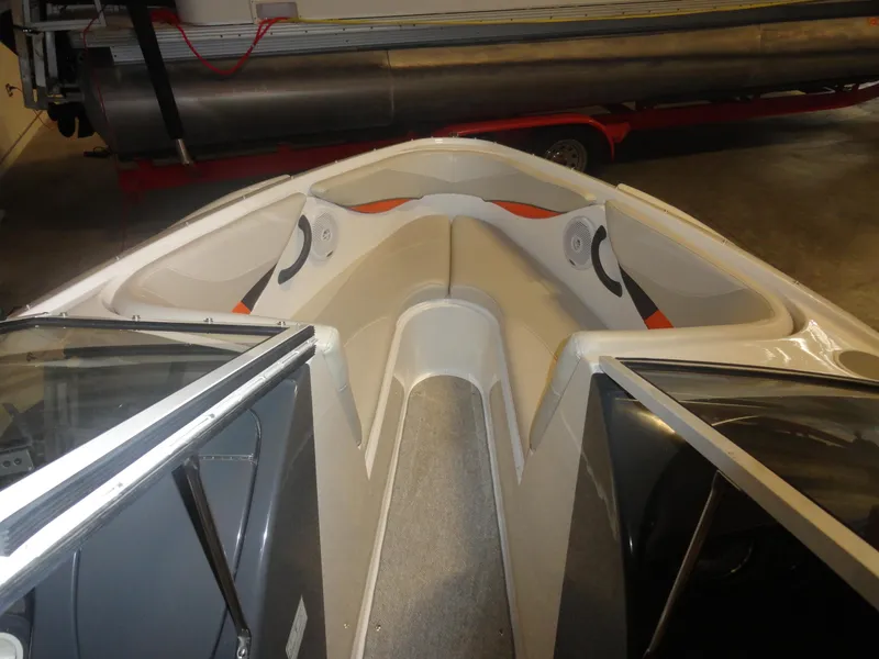 Slide: The Image of 2005 Campion Chase 550I BR boat interior with open bow seating and modern design. - 14