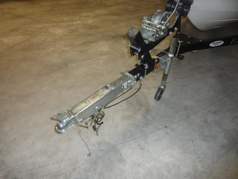 Slide: The Image of Trailer hitch of a 2005 Campion Chase 550I BR boat on concrete floor. - 17