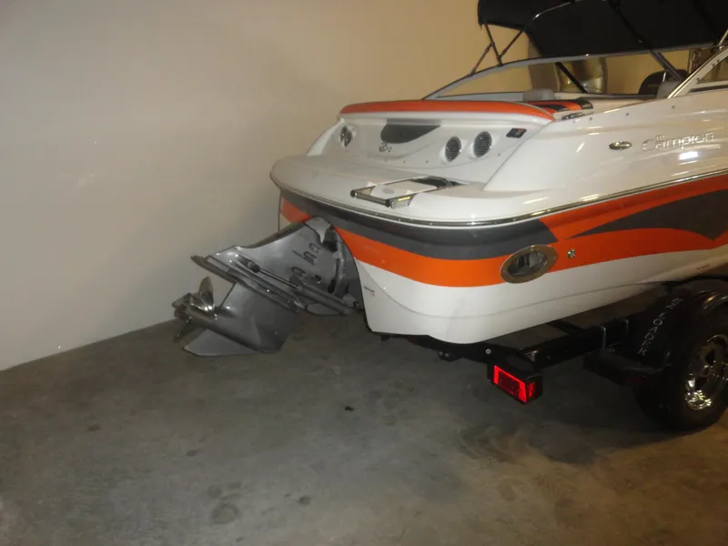 Slide: The Image of 2005 Campion Chase 550I BR boat, rear view, in a garage setting. - 18