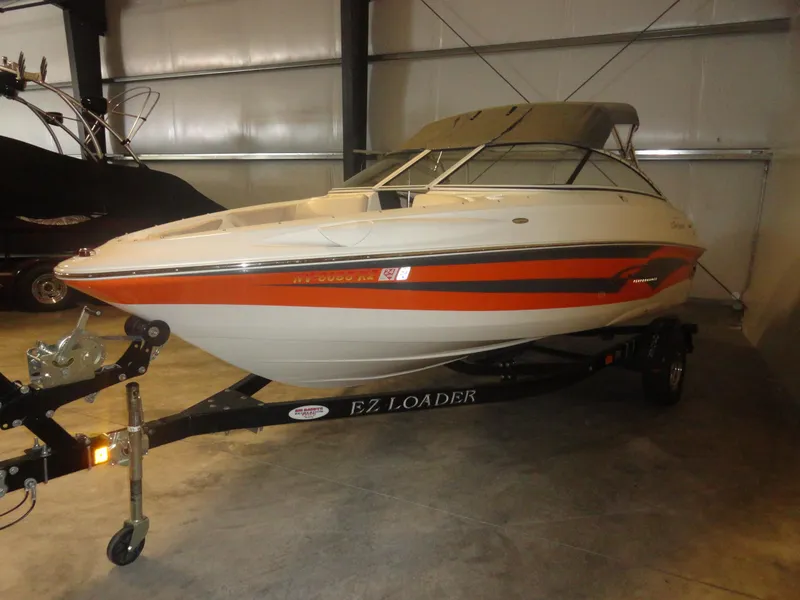 Slide: The Image of 2005 Campion Chase 550I BR boat on trailer in indoor storage. - 4