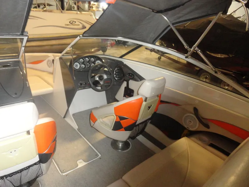 Slide: The Image of 2005 Campion Chase 550I BR boat interior with steering wheel and seating. - 6