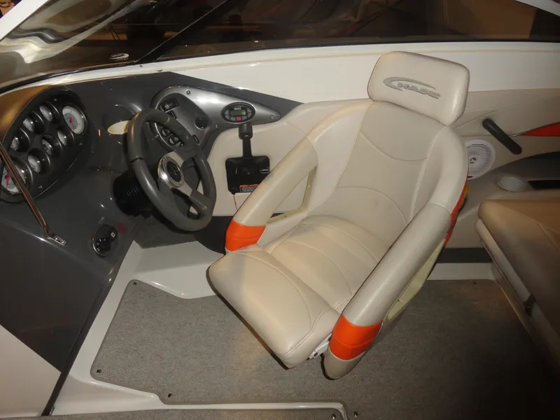 Slide: The Image of Interior of 2005 Campion Chase 550I BR boat with steering wheel and captain's seat. - 8