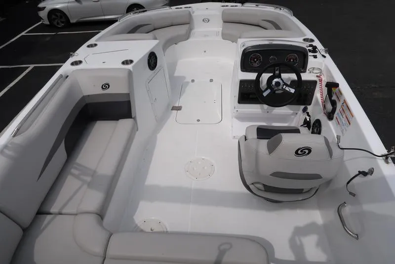 Slide: The Image of 2023 Hurricane SunDeck Sport 188 OB boat interior with seating and steering console. - 13