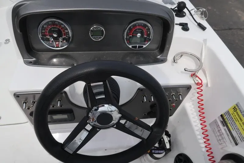 Slide: The Image of Steering console of 2023 Hurricane SunDeck Sport 188 OB boat with gauges and controls. - 15