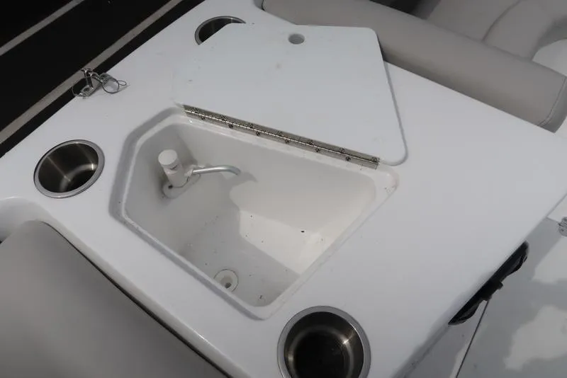 Slide: The Image of 2023 Hurricane SunDeck Sport 188 OB boat sink with cup holders and cover. - 19