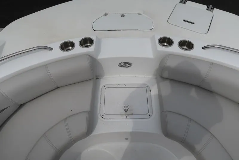 Slide: The Image of 2023 Hurricane SunDeck Sport 188 OB boat interior with seating and cup holders. - 23