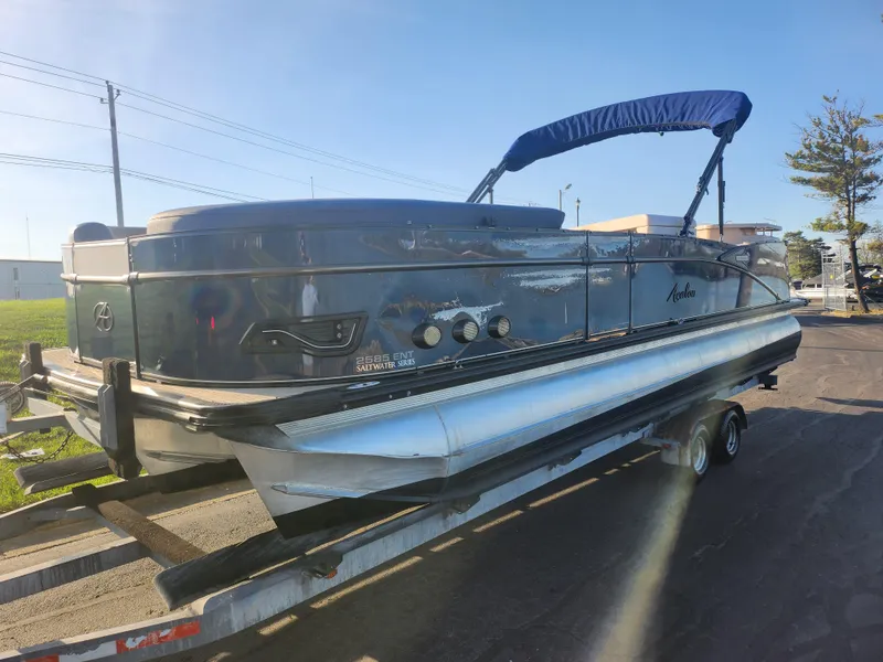 Slide: The Image of 2021 Avalon Catalina Platinum Entertainer Funship boat on trailer, blue canopy, sunny day. - 5