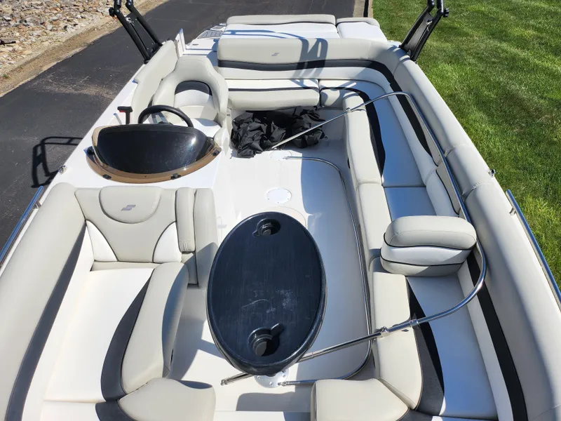 Slide: The Image of 2021 Starcraft Star Step 221 E I/O boat interior with seating and table. - 12