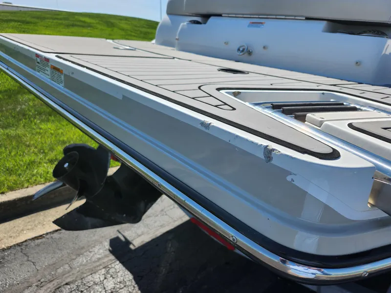 Slide: The Image of 2021 Starcraft Star Step 221 E I/O boat stern with swim platform and propeller. - 2