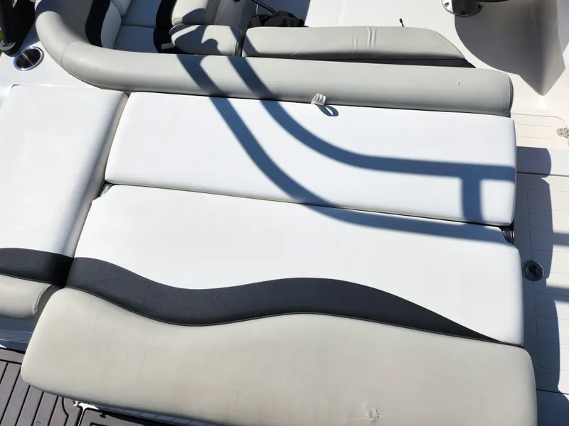 Slide: The Image of 2021 Starcraft Star Step 221 E I/O boat interior with cushioned seating. - 21