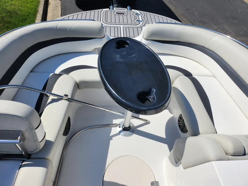 Slide: The Image of 2021 Starcraft Star Step 221 E I/O boat interior with seating and table. - 26