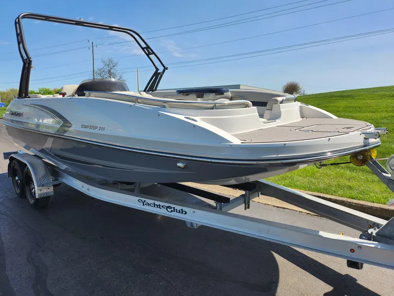 Slide: The Image of 2021 Starcraft Star Step 221 E I/O boat on trailer, parked outdoors. - 7