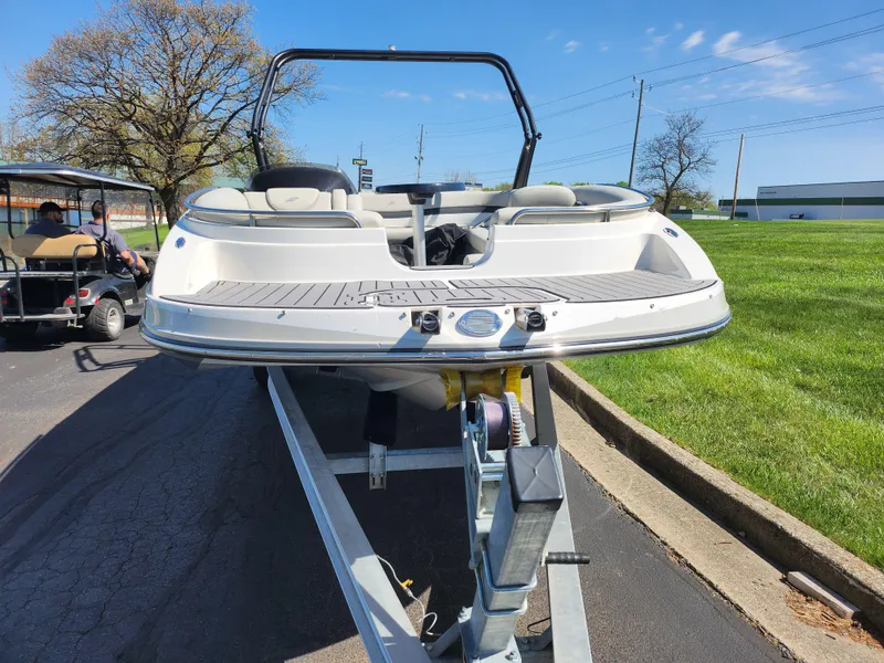 Slide: The Image of 2021 Starcraft Star Step 221 E I/O boat on trailer, parked outdoors. - 8