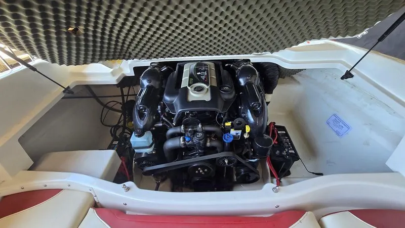 Slide: The Image of 2014 Tahoe Q5i boat engine compartment with visible components and wiring. - 7